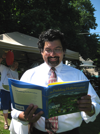 Massachusetts Agriculture Commissioner Scott Soares at a recent visit to the Farmers' Market in Shelburne Falls (Note his EXCELLENT taste in books!)