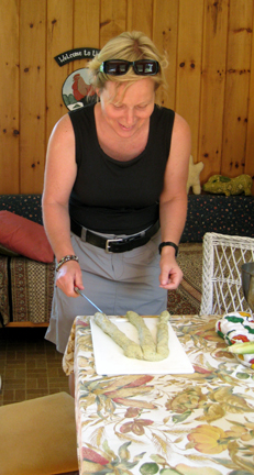 Anna prepares to braid bread.
