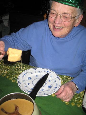 Kay samples the fondue.